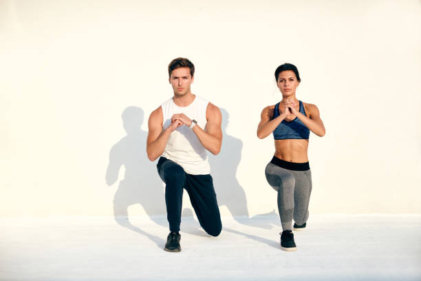 istock Caucasian couple working out isolated on white 1066837732