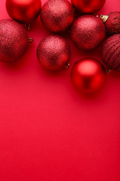 istock Red Christmas balls on a red background 1066838820