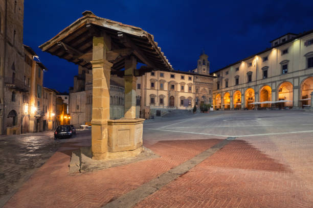 A cloudy day in Arezzo reveals a stunning cityscape of bell towers, towers, and roofs viewed from the Confraternita dei Laici tower. A unique and breathtaking perspective of the city.