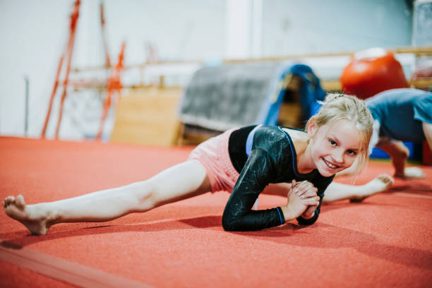 istock Young gymnast stretching her body 1066840392