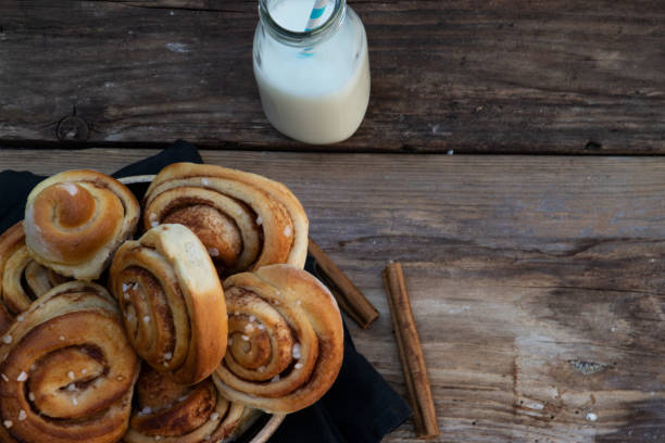 Homemade cinnamon rolls with a glas of milk stock photo