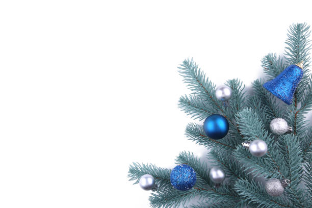 istock Christmas tree branches with christmas decoration on a white background 1066843264