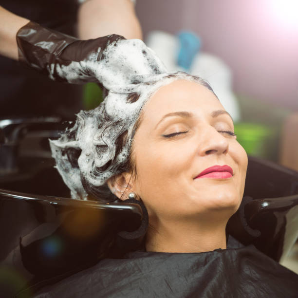 istock Shampooing a woman hair 1066845602