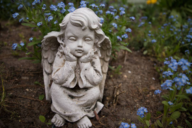 Angel with flowers stock photo