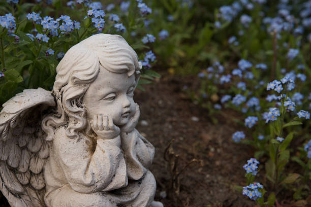 istock Lovely angel with blue flowers 1066846848