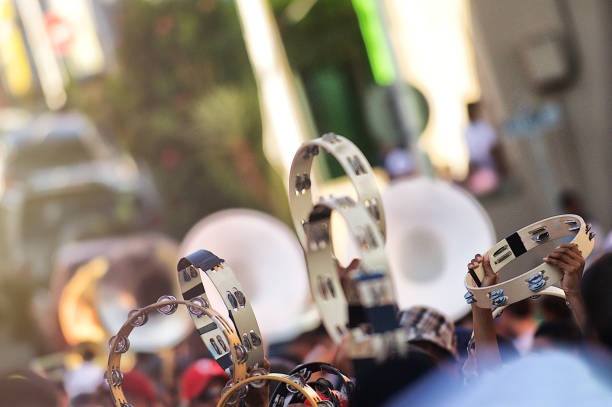 Tambourines held high during a street Carnival parade Kaapse Klopse Cape Malay Quarters Cape Town