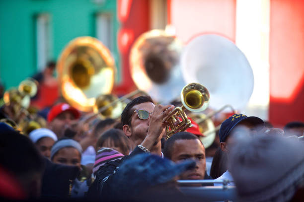 Heritage Day Celebrations, Bo Kaap, Cape Town, South Africa - 24 September, 2018 : Trumpet blowers of the the traditional Kaapse Klopse music street carnival with a marching band n civilian dress from the Bo Kaap Community's Big Band Theory celebrating Heritage Day with onlookers through the historic Malay Quarters in Cape Town