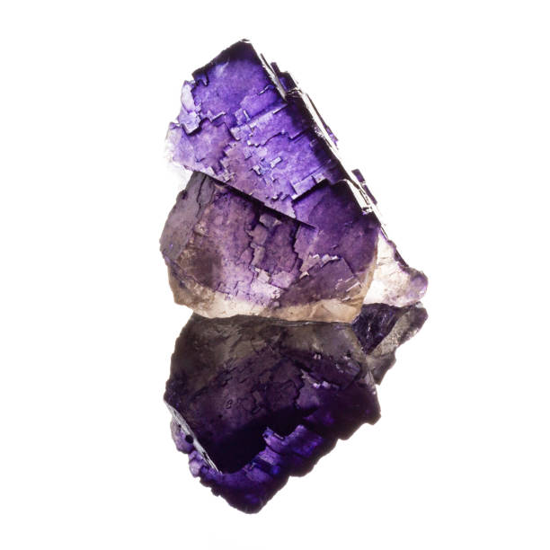 istock Natural untreated stone fluorite on a white backround with reflection 1066863352