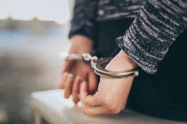 Arrested - Handcuffs Prison, Back, Buttocks, Human Back, Human Hand, Crime handcuffs stock pictures, royalty-free photos & images