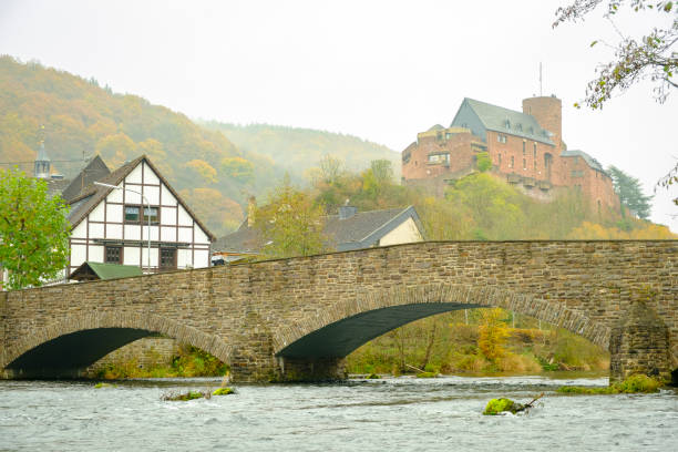 Heimbach village and Rur river in the Eifel in Germany during an overcast autumn day.