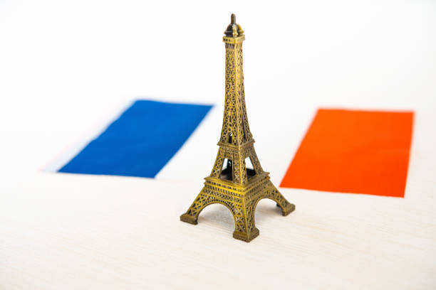 istock Metal Eiffel Tower and French flag on background 1066868154