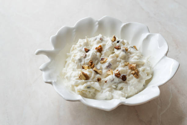 istock Celery Salad with Yogurt and Walnuts in Leaf Shaped Plate 1066870454