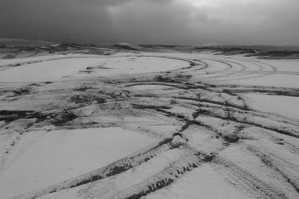 istock Tire tracks in snow 1066870696