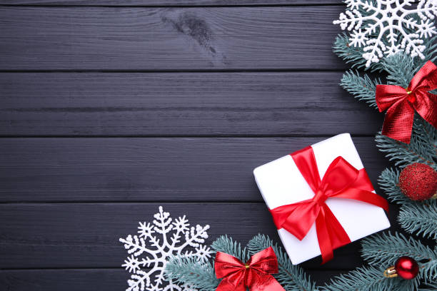 istock Christmas gift presents with decorations on a black background. 1066870804