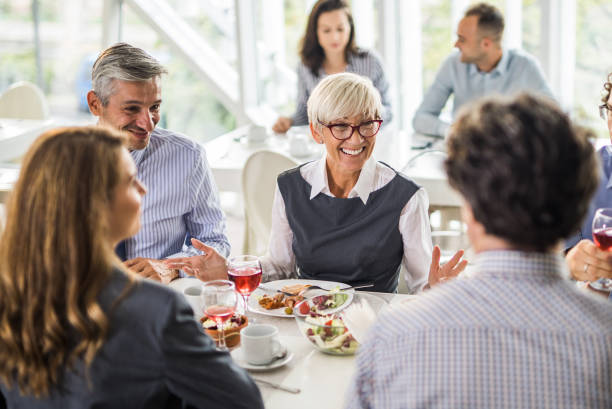 istock Happy business people talking on a lunch in a restaurant. 1066873512