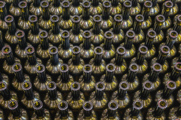 istock Wine bottles background, winemaking process to preparing wine for bottling in a winery, top view 1066873602