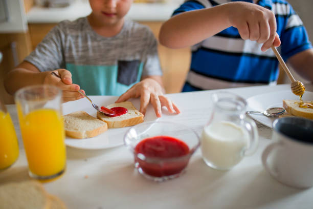 istock Happy kids having healthy breakfast 1066879796