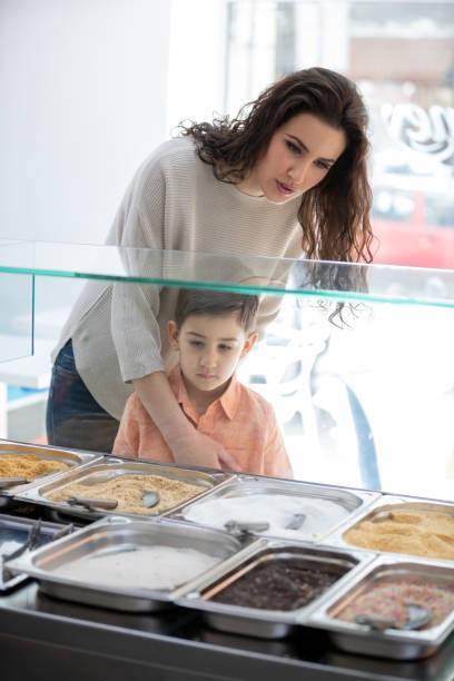 istock Looking at toppings with mother 1066880320