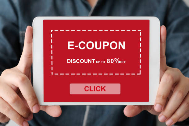 istock Hand holding digital tablet with discount coupon code on screen to get the shopping on line sale promotion, on line shopping ,digital marketing business and technology, lifestyle concept 1066880962