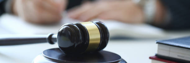 istock The judge hammer lies on table in 1066882532