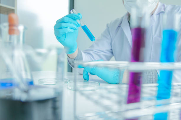 istock Medical science or male in laboratory room researcher performs tests with blue liquid on test tube , Experimental Drug Treatment Chemicals 1066887438