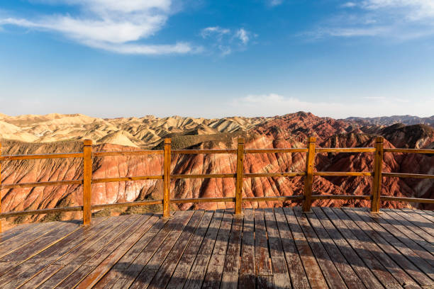 istock Empty wooden board front of mountain ranges 1066887880