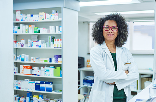 Portrait of a confident mature woman working in a pharmacy