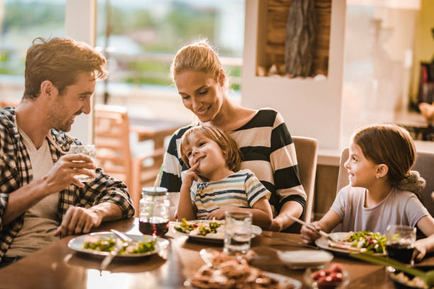 istock Happy family during lunch time in dining room. 1066893362