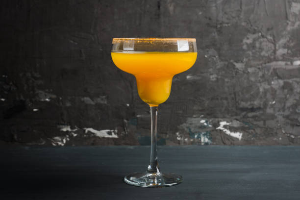 istock Tasty pumpkin margarita cocktail on the rustic background 1066893638