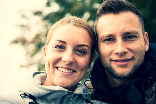 istock Two hikers taking selfie in mountains 1066893836