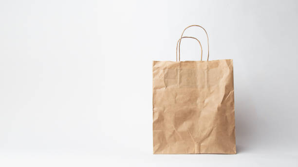 istock Various kraft paper bags and wrapping paper isolated on white background 1066894182