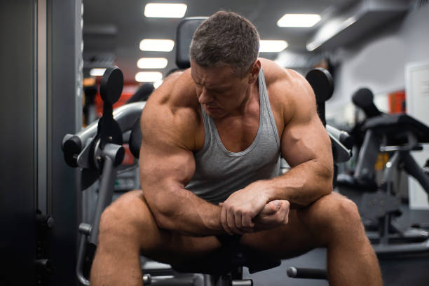 istock athletic man trains in the gym. Rest after exercise 1066898380