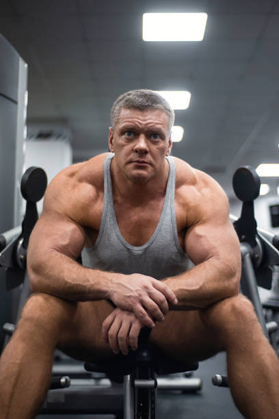 istock athletic man trains in the gym. Rest after exercise 1066898502