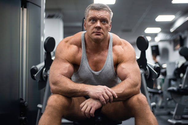 istock athletic man trains in the gym. Rest after exercise 1066898526