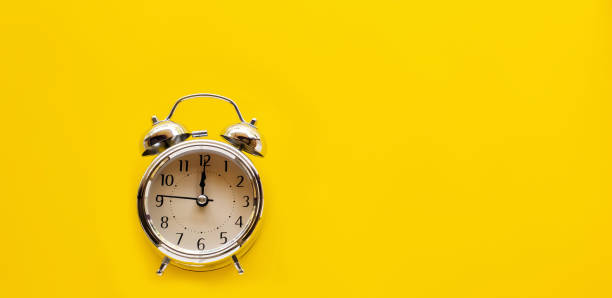 istock Top view. vintage clock. Minimal Style copyspace for your text on yellow background use for wallpaper and screen. 1066898830