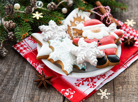 Christmas cookies and Christmas tree on a old wooden background