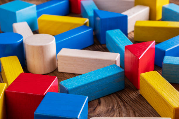istock Abstract Background. Background with different colorful shapes wooden blocks. 1066906598