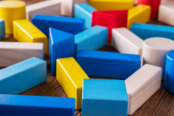istock Abstract Background. Background with different colorful shapes wooden blocks. 1066906670