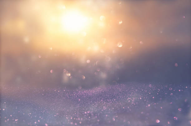 istock glitter vintage lights background. silver, blue, purple and gold. de-focused. 1066909284