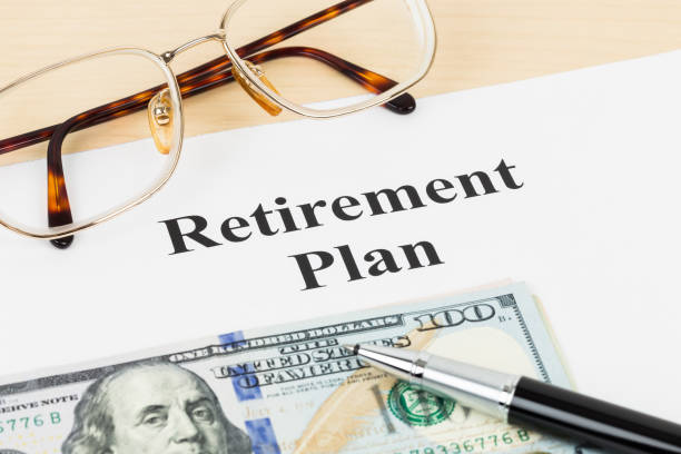 istock Retirement plan with banknote, glasses, and pen 1066911072