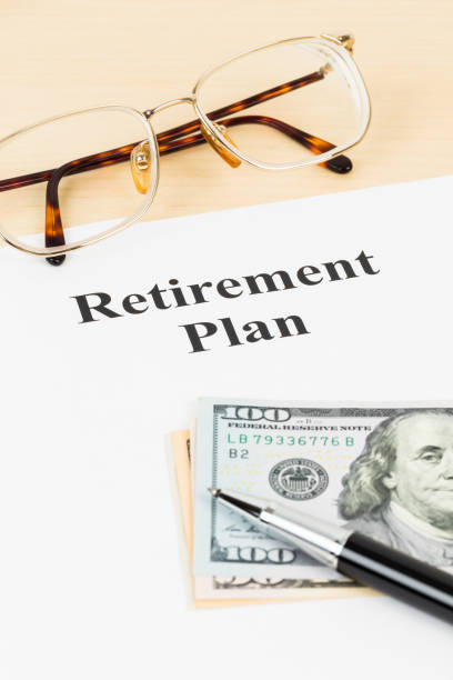 istock Retirement plan with banknote, glasses, and pen 1066911074