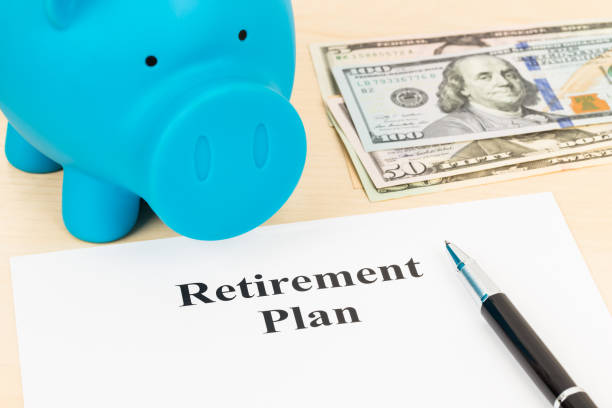 istock Retirement plan with banknote, piggy bank, and pen 1066911086