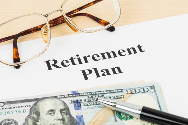 istock Retirement plan with banknote, glasses, and pen 1066911096