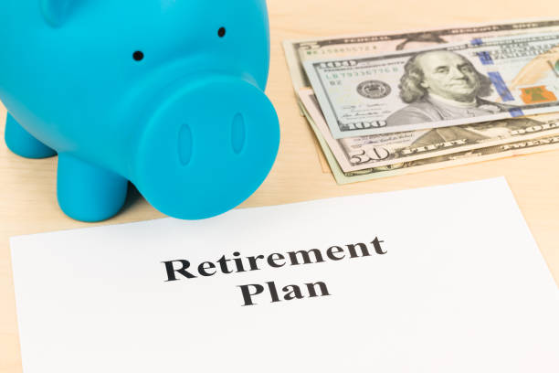 istock Retirement plan with banknote, piggy bank, and pen 1066911110