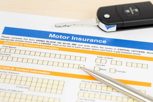 istock Motor or car insurance application with pen and car key 1066911290