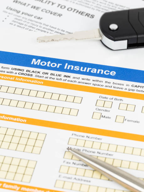 istock Motor or car insurance application with pen and car key 1066911296