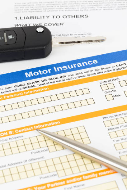 istock Motor or car insurance application with pen and car key 1066911300