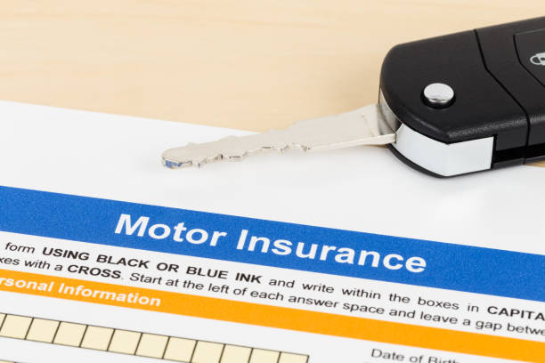 istock Motor or car insurance application with car key; document is mock-up 1066911304