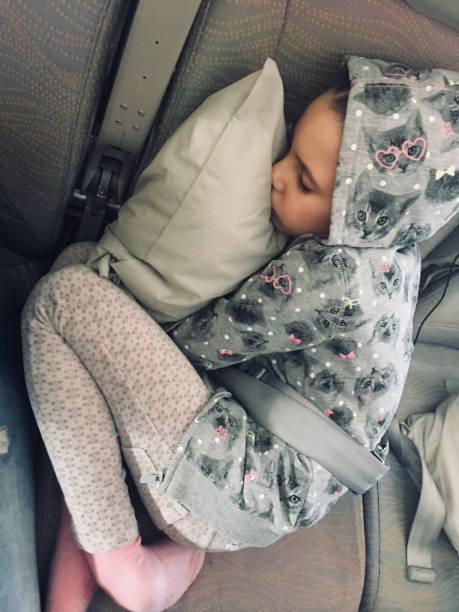 istock Young Girl Sleeping in a Car 1066911994
