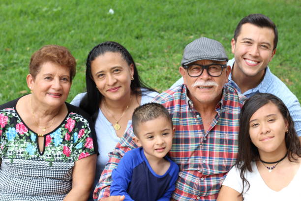 hispanic family in the park - mexican ethnicity imagens e fotografias de stock